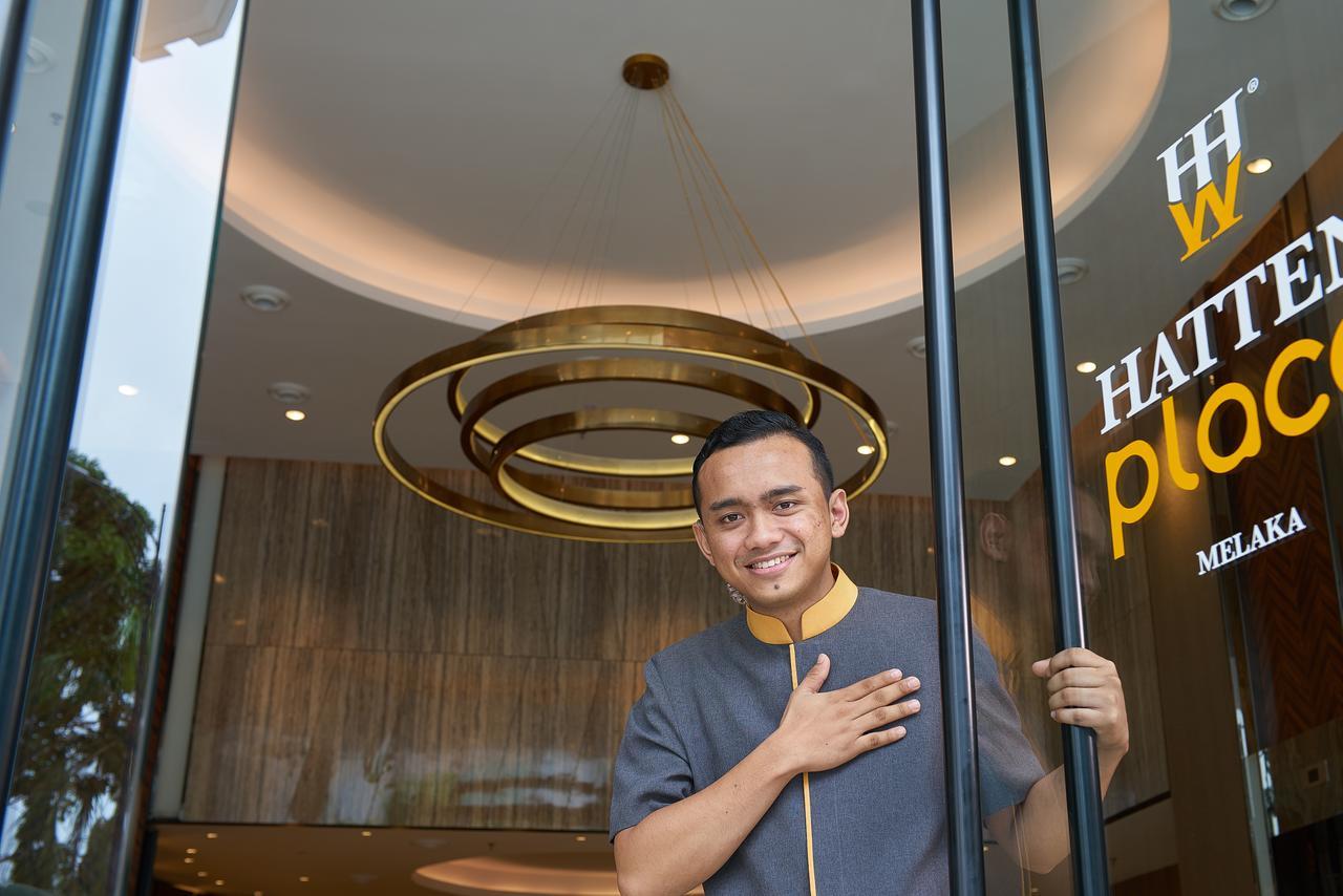 Hatten Place Melaka Εξωτερικό φωτογραφία A doorman at the entrance of a hotel in Malaysia.